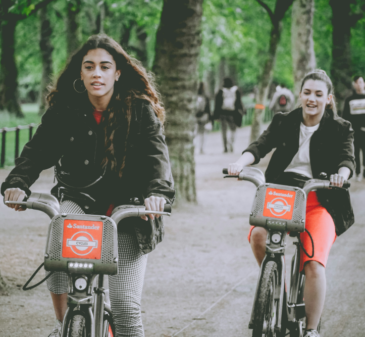 People cycling in a park.